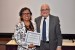 Dr. Nagib Callaos, General Chair, giving Dr. Maritza Placencia Medina the best paper award certificate of the session "Educación, Sistemas y Globalización Académica." The title of the awarded paper is "Primera Experiencia de Blended-Learning para Fortalecer Habilidades Quirúrgicas Básicas en Estudiantes de Medicina Humana de una Universidad Nacional en Perú."